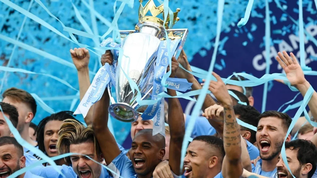 Fernandinho retirement celebration - Manchester City Premier League trophy lift before strategic exit at 40