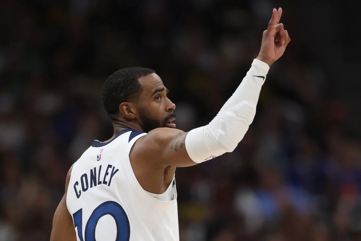 Timberwolves mike conley retirement decision discussions as Mike Conley celebrates in Minnesota uniform